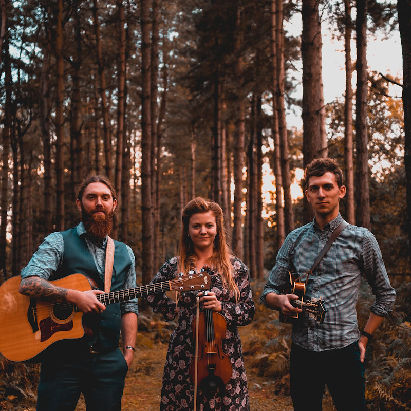 The Shackleton Trio - Deepdale Festival | 26th to 29th September 2019 - Wonderfully talented Norfolk-based folk trio, with the unique folk voice of Georgia Shackleton complemented by the exceptional guitar of Aaren Bennett and the sublime mandolin playing of Nic Zuppardi. With their second alum under their belt, Fen, Farm and Deadly Water, their songwriting and playing has moved to a deeper even more assured level. Simply wonderful!